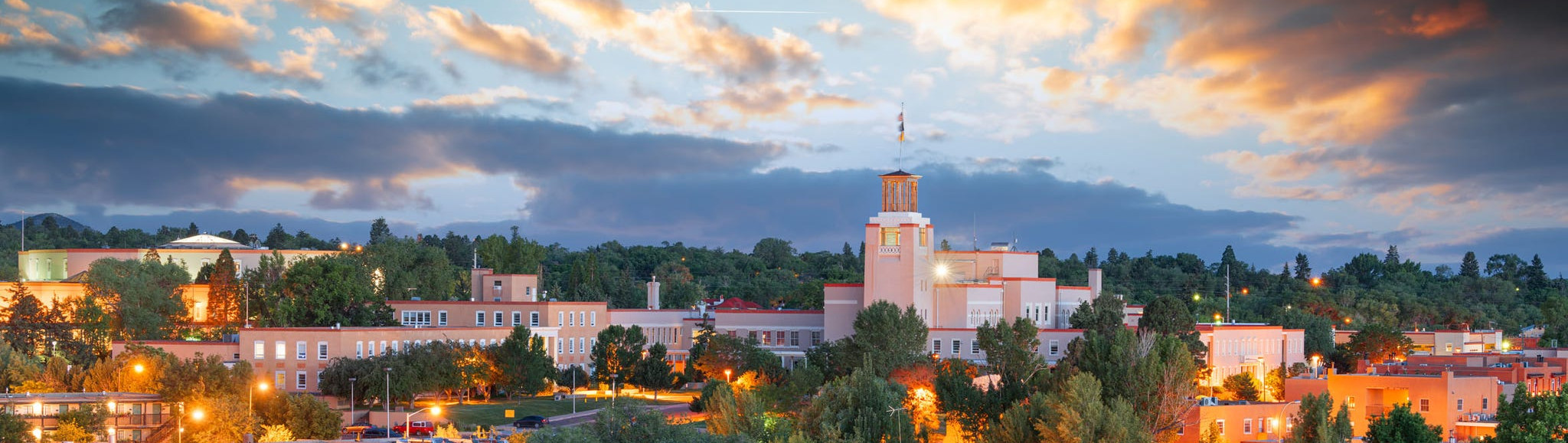 A crowded presentation room with a person on stage
